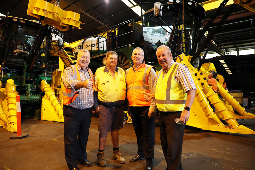 Mayor Jack Dempsey and Cr Steve Cooper join harvester Garry Walk and Canetec General Manager Glenn Soper to view the new AX9000 models.