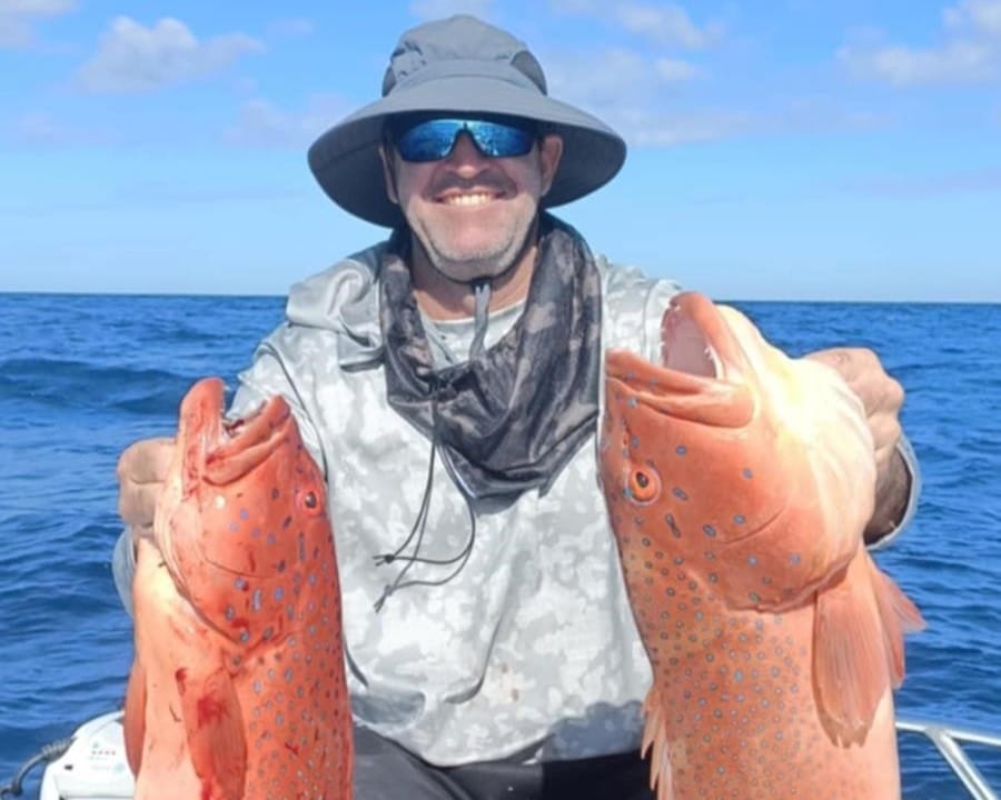 Andy Gatt with a pair of big barcheek coral trout