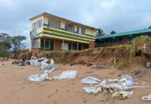 Significant erosion has exposed the foundations of a building on the Moore Park Beach Foreshore.