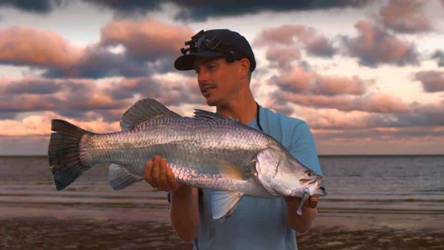 Team member Jeremy Chaseling with a nice 85cm barra caught land based off the beach!