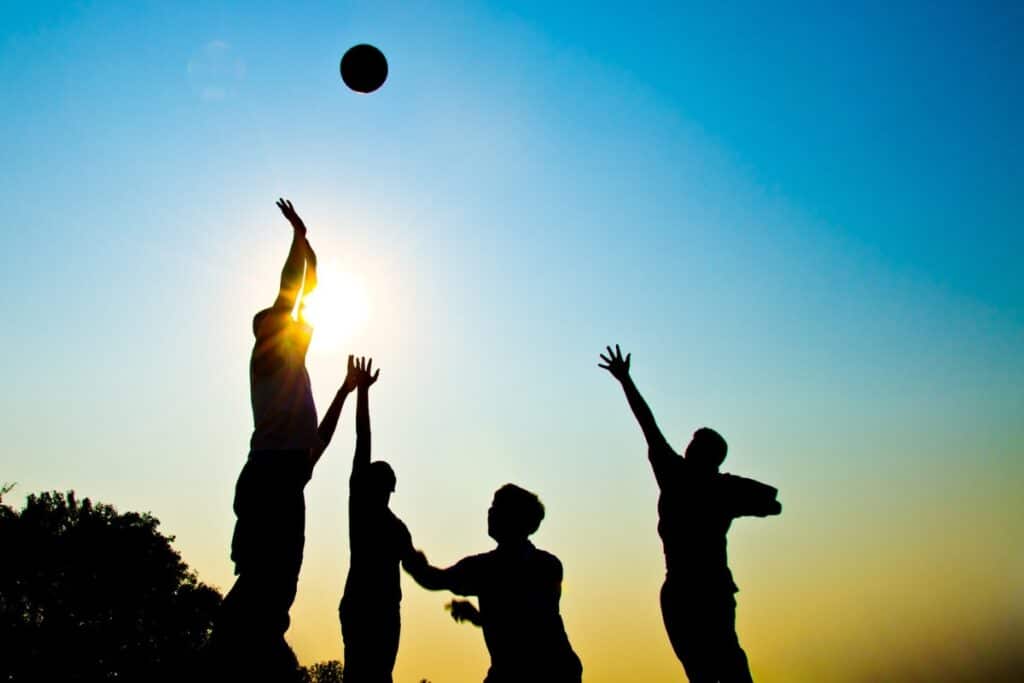 Silhouette of youth playing basketball